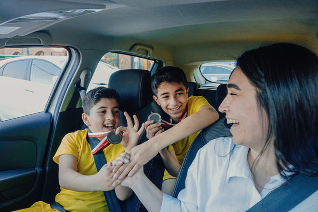 Cheerful Family with Mother and Soccer Player Boys 